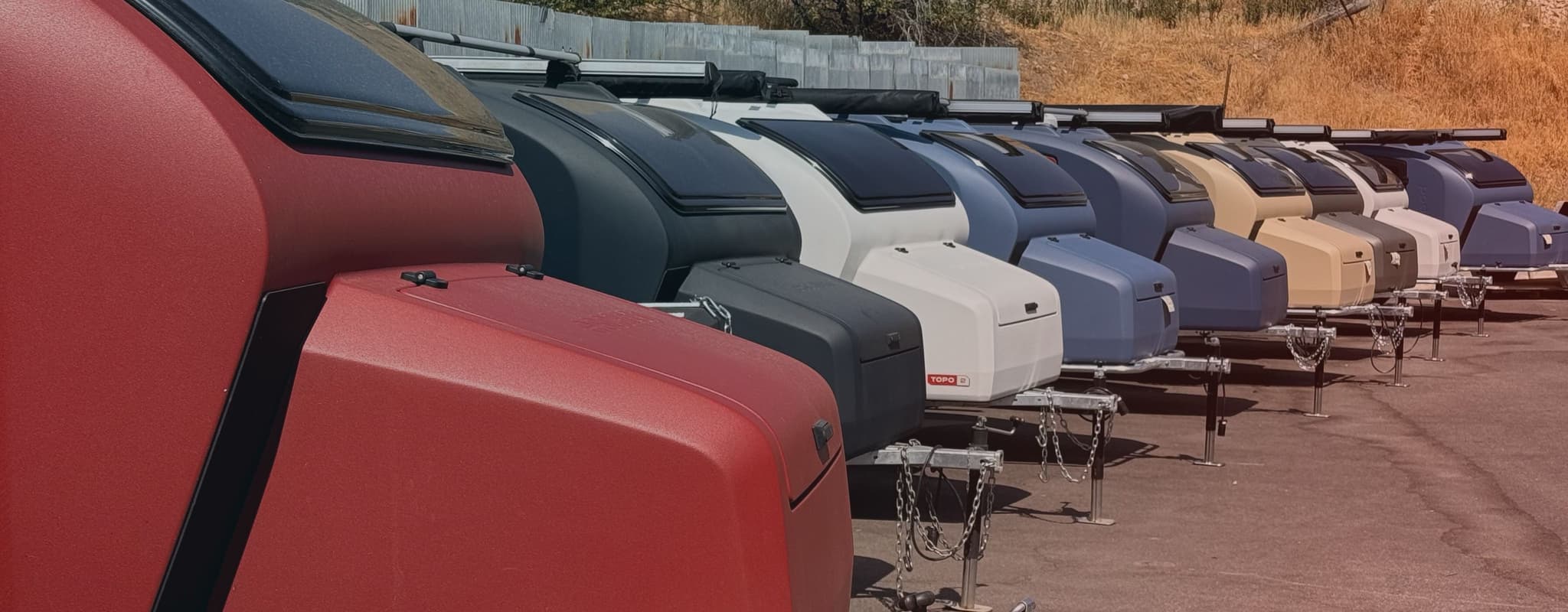 A row of Escapod TOPO2s in various colors on display at their factory in Coalville, Utah.