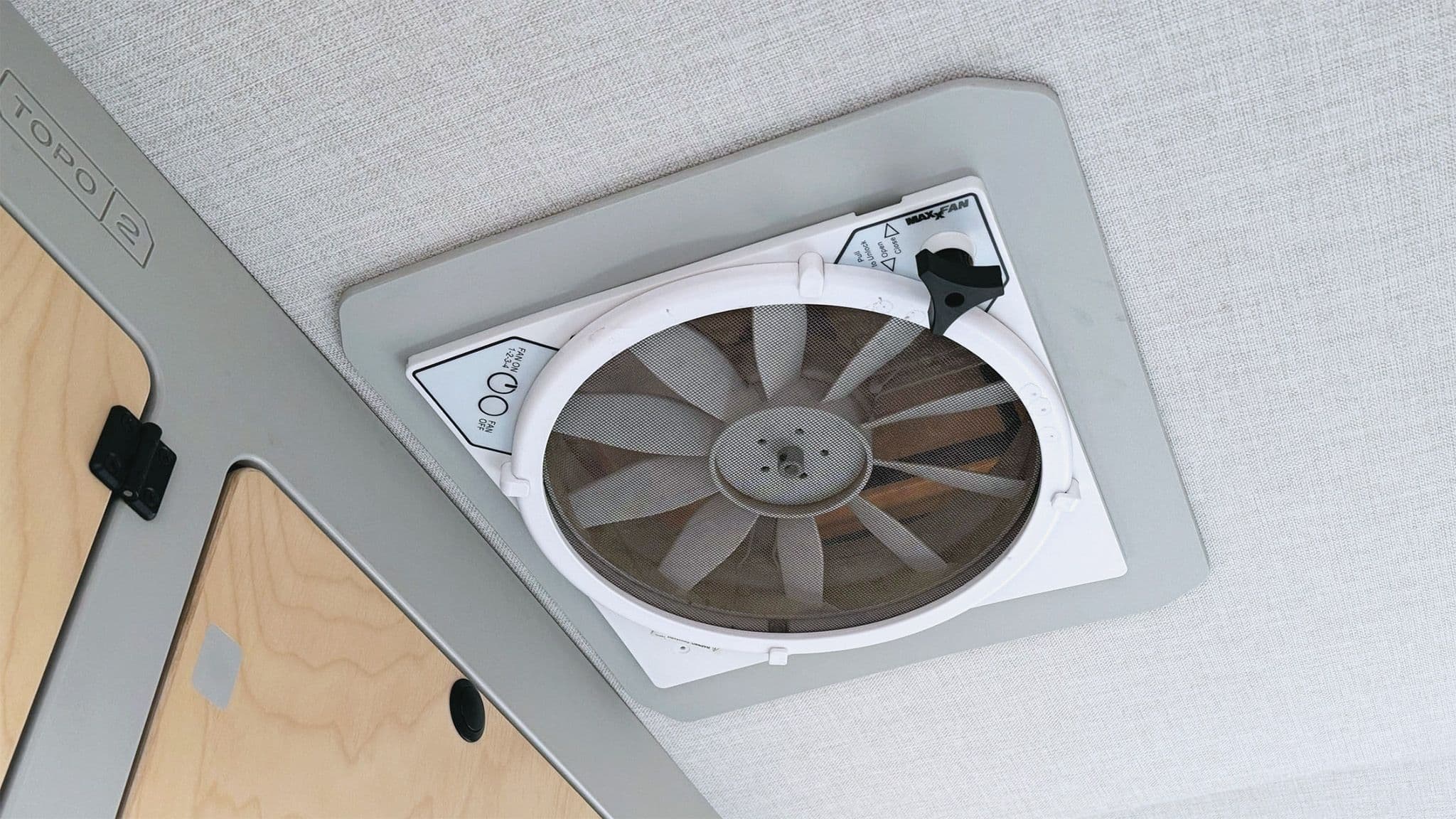 The four-speed MaxxAir exhaust fan mounted in an Escapod TOPO2, circulates air, cooling the cabin and preventing condensation.